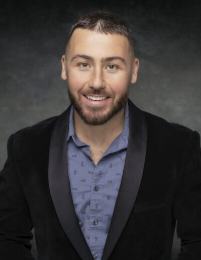 Headshot photo of man in suit