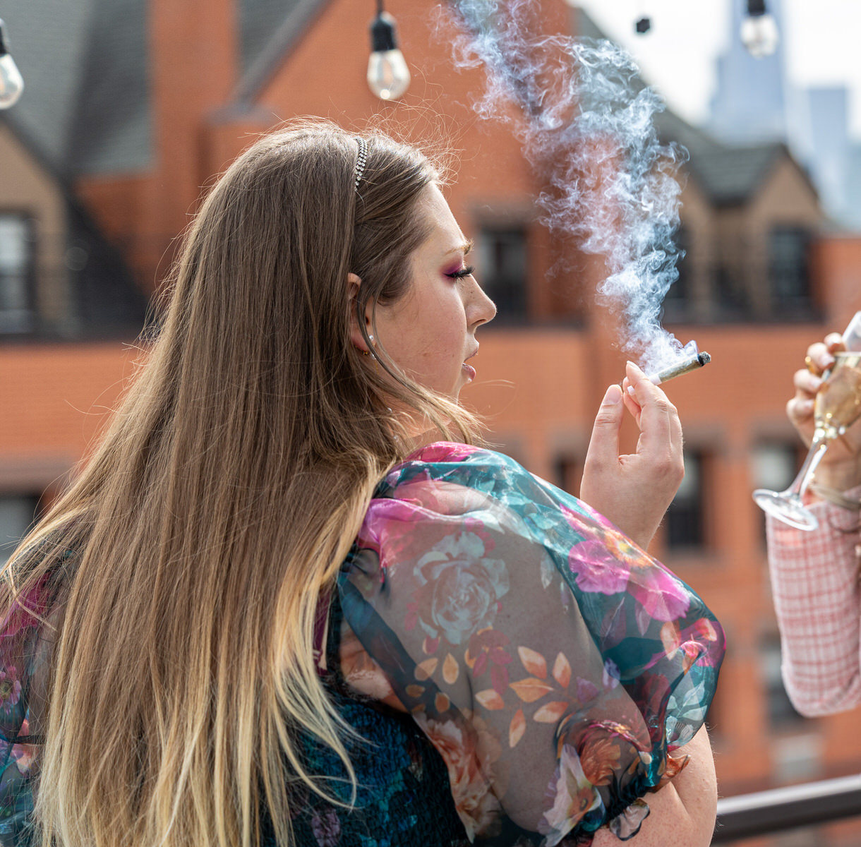 woman in fancy dress smoking weed