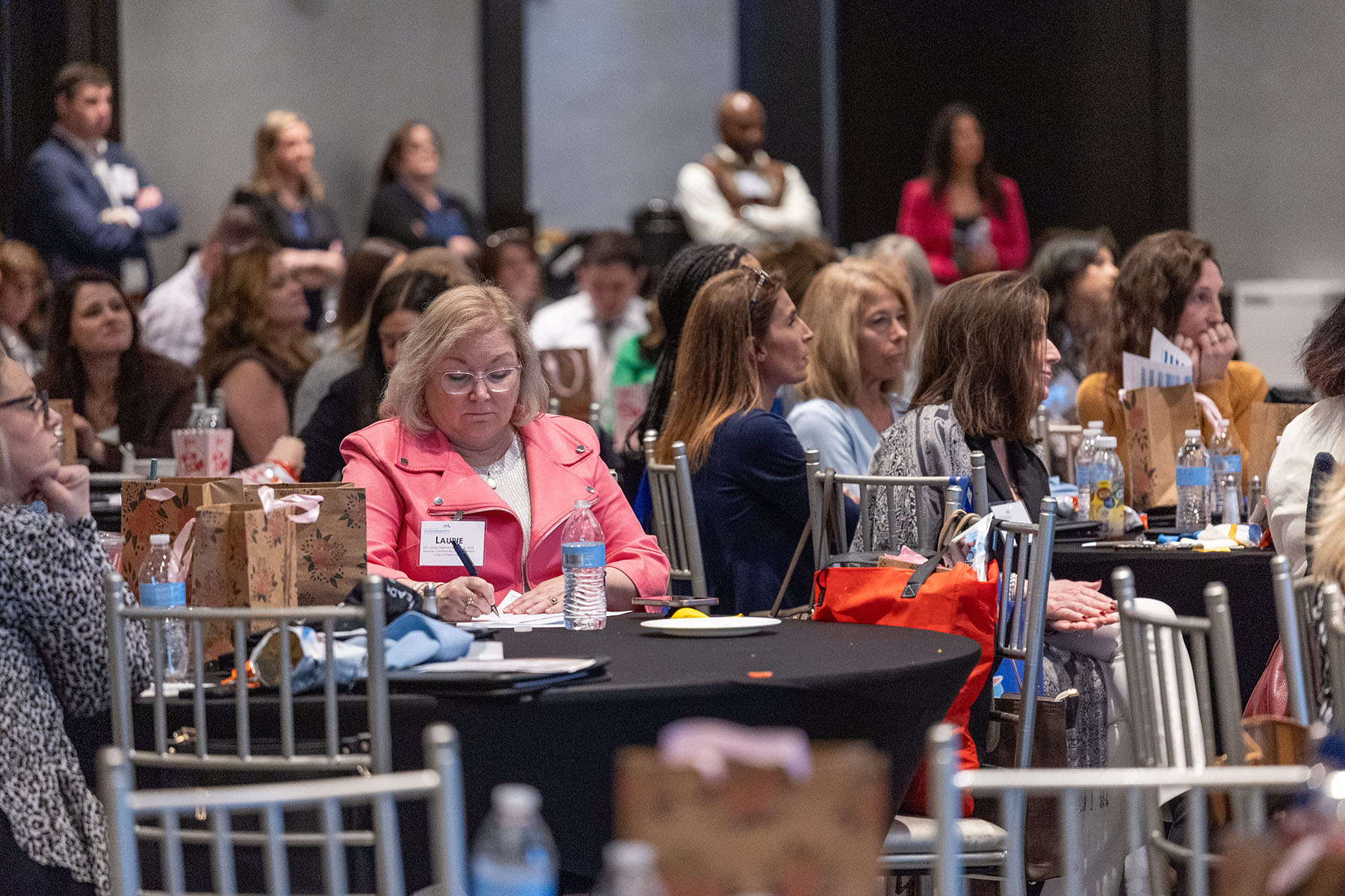 Large Conference audience taking notes