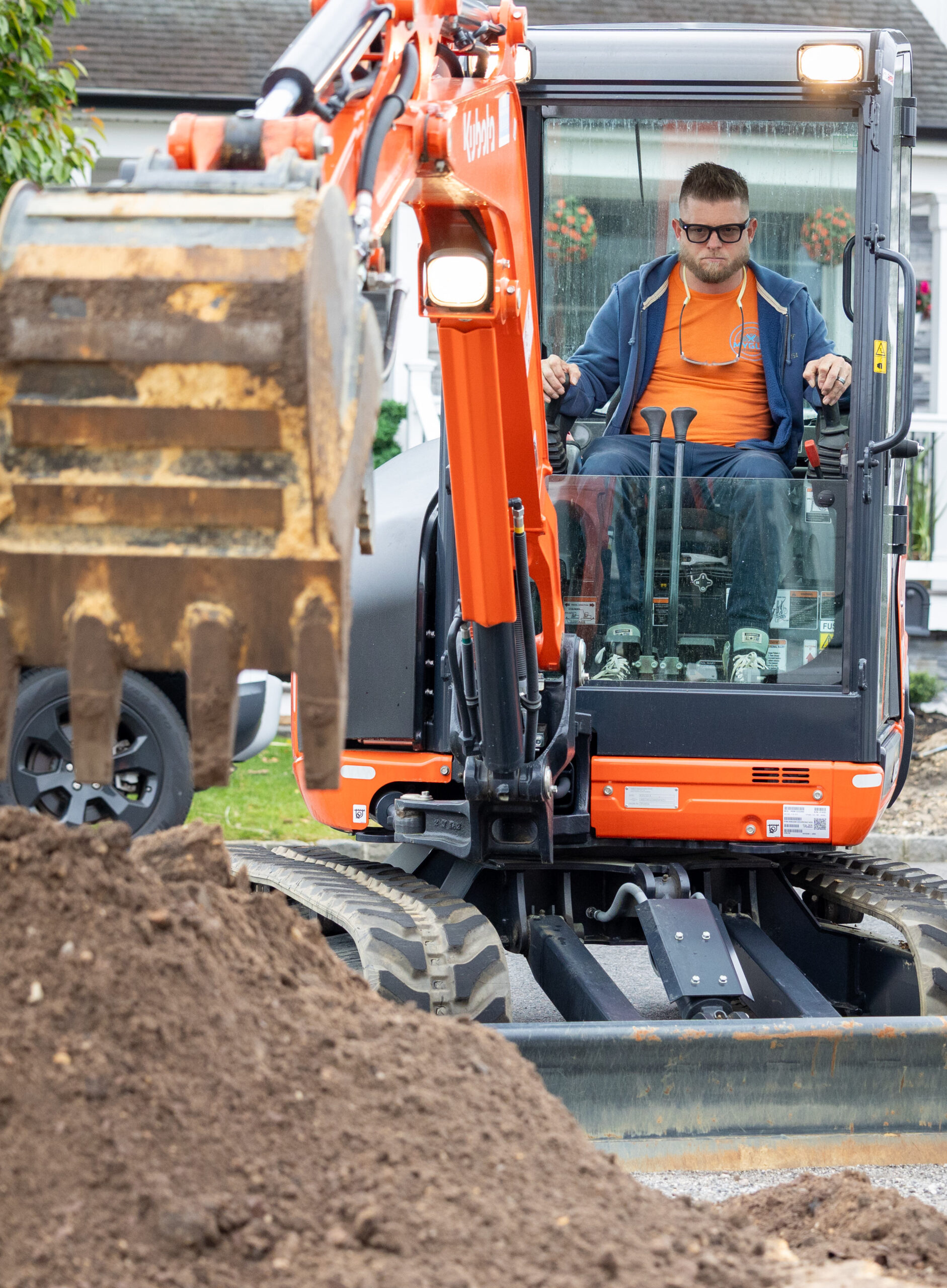 plumber on backhoe digging